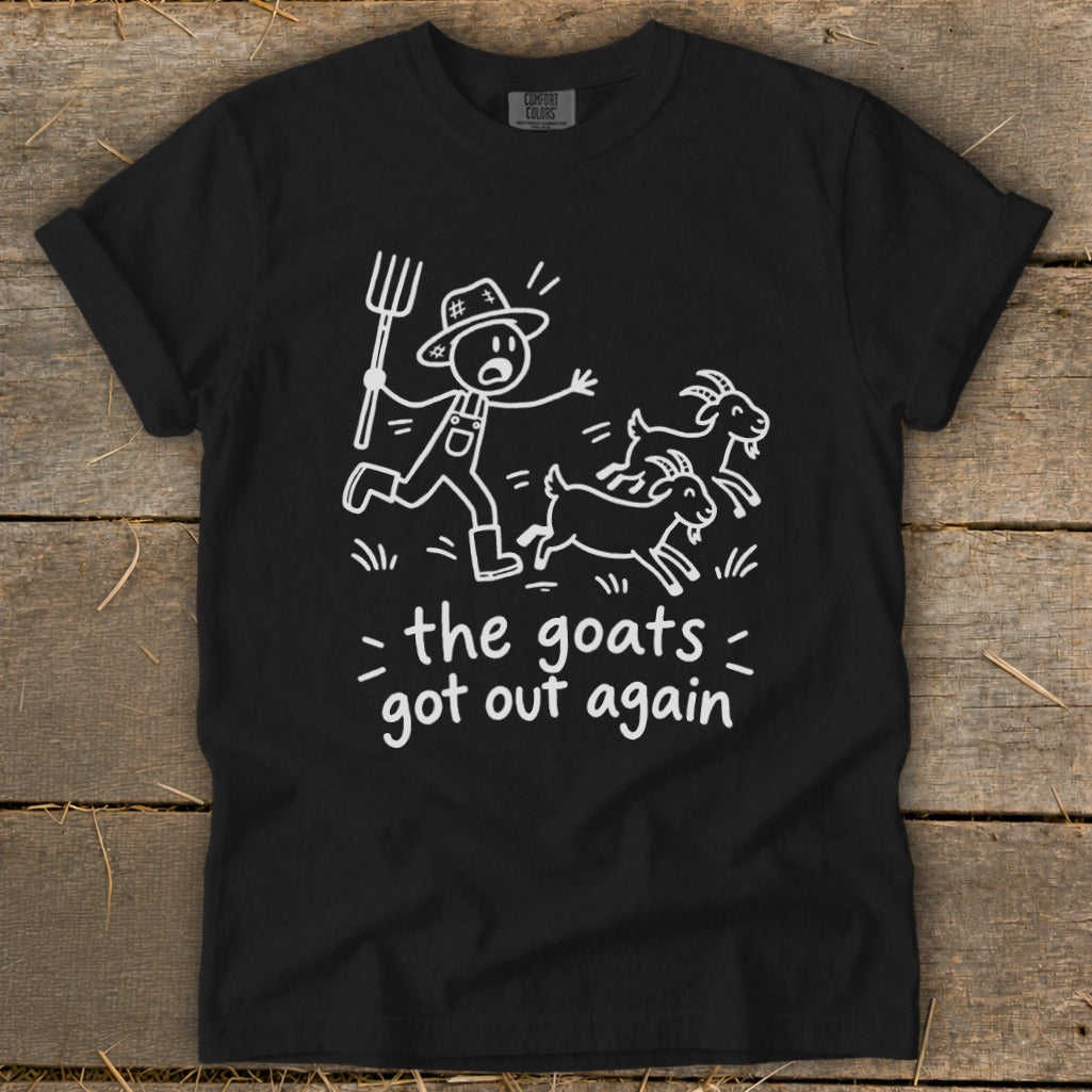 Black t-shirt with white graphic of farmer chasing goats and text "the goats got out again".