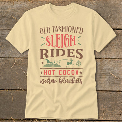 Cream t-shirt with "Old Fashioned Sleigh Rides, Hot Cocoa, Warm Blankets" text and illustrations.