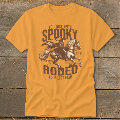 Orange t-shirt with "Spooky Rodeo" graphic and text "You Just Yee'd", "Oct 31", "Western Style", "Your Last Haw!".