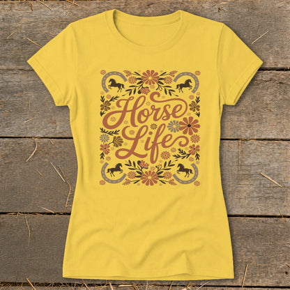 Yellow t-shirt with "Horse Life" text, horses, horseshoes, and floral design.
