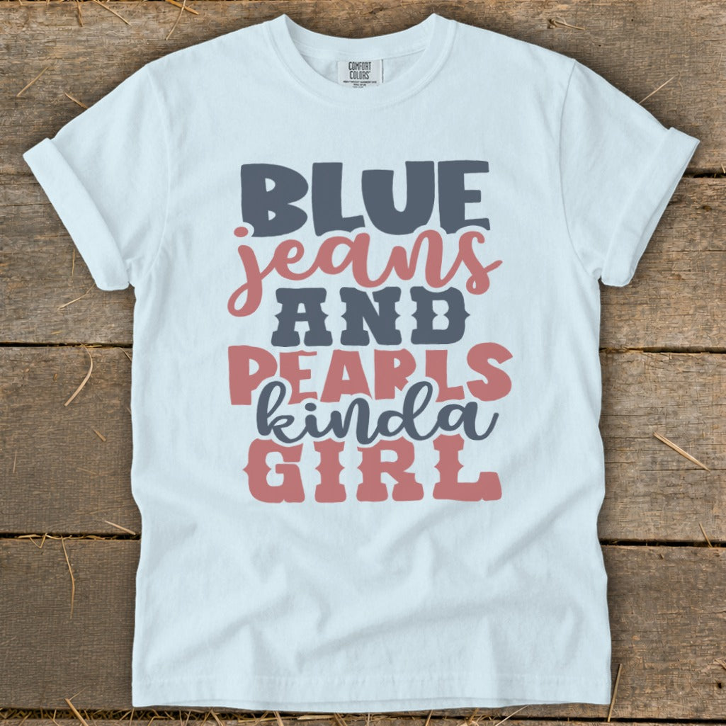 White t-shirt with "BLUE jeans AND PEARLS kinda GIRL" text in gray and pink.