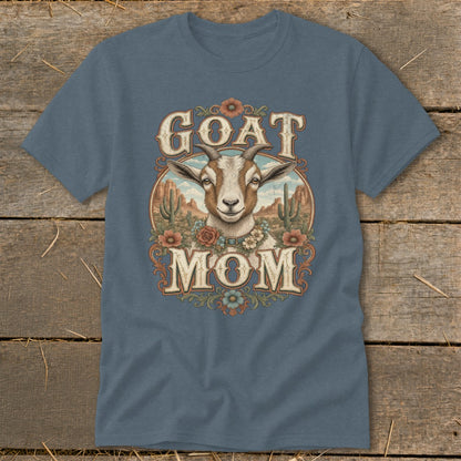 Goat Mom graphic on a blue t-shirt with desert scene and floral accents.