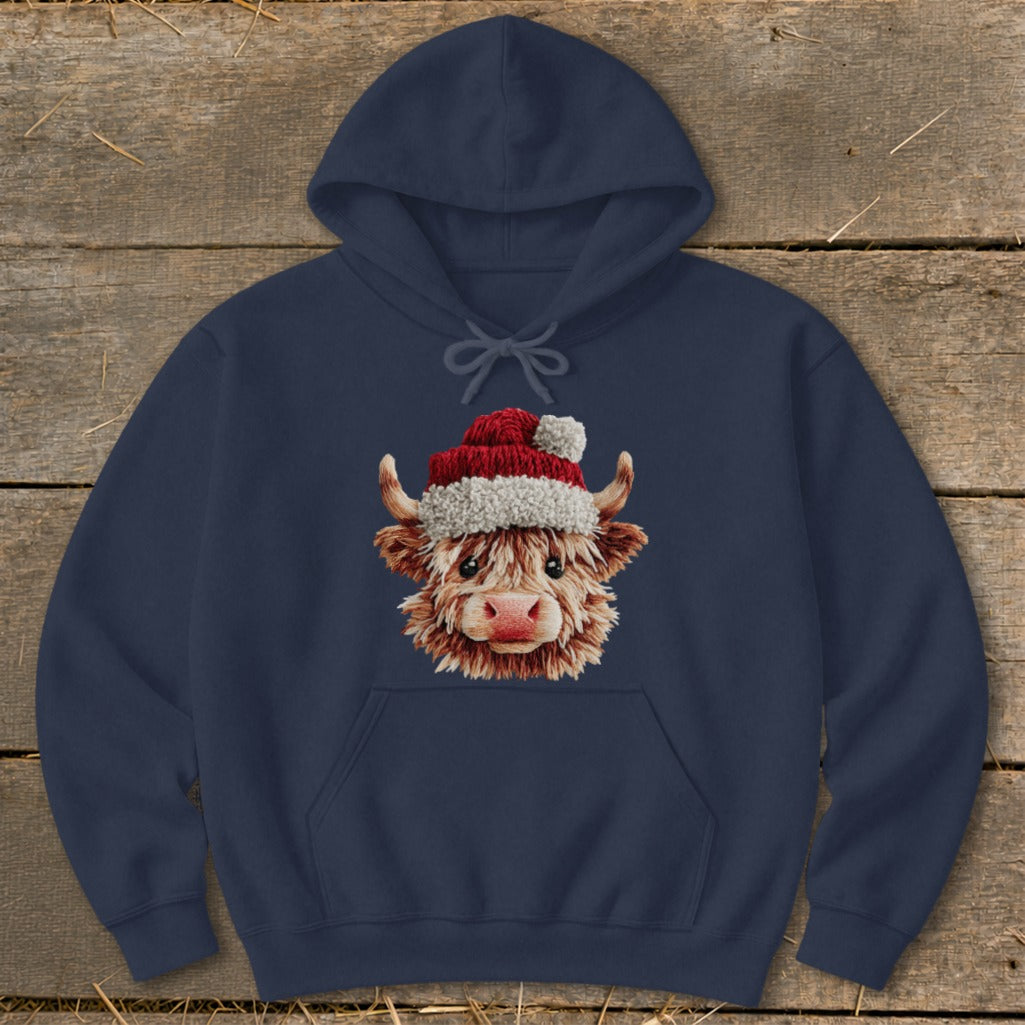 Navy hoodie with a festive Highland cow wearing a Santa hat.