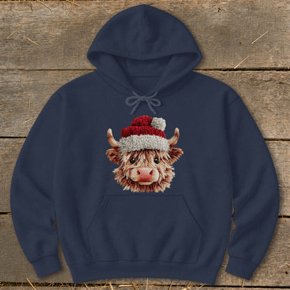 Navy hoodie with a festive Highland cow wearing a Santa hat.