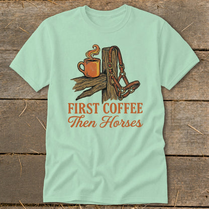 Graphic tee with coffee cup and horse halter, reads "First Coffee Then Horses".