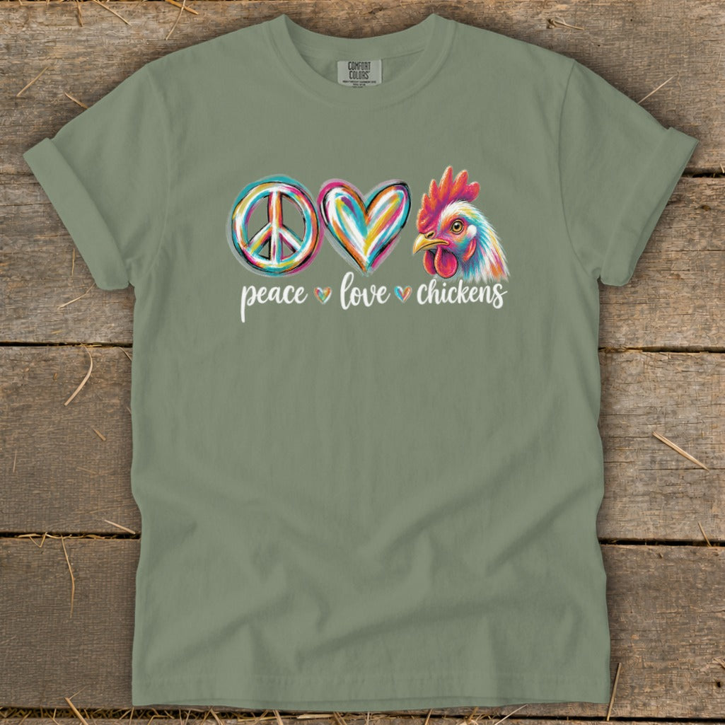 Green t-shirt with peace, heart, and chicken graphic and text "peace love chickens."
