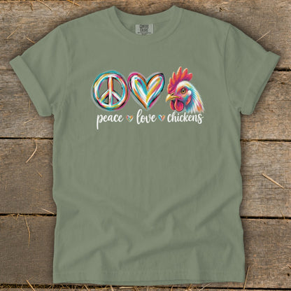 Green t-shirt with peace, heart, and chicken graphic and text "peace love chickens."