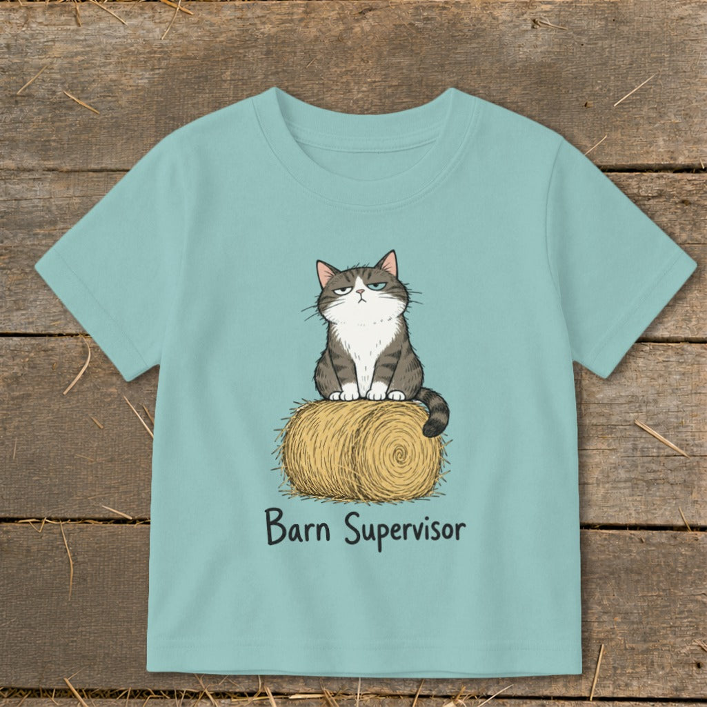 Illustration of a grumpy cat sitting on a hay bale with "Barn Supervisor" text.