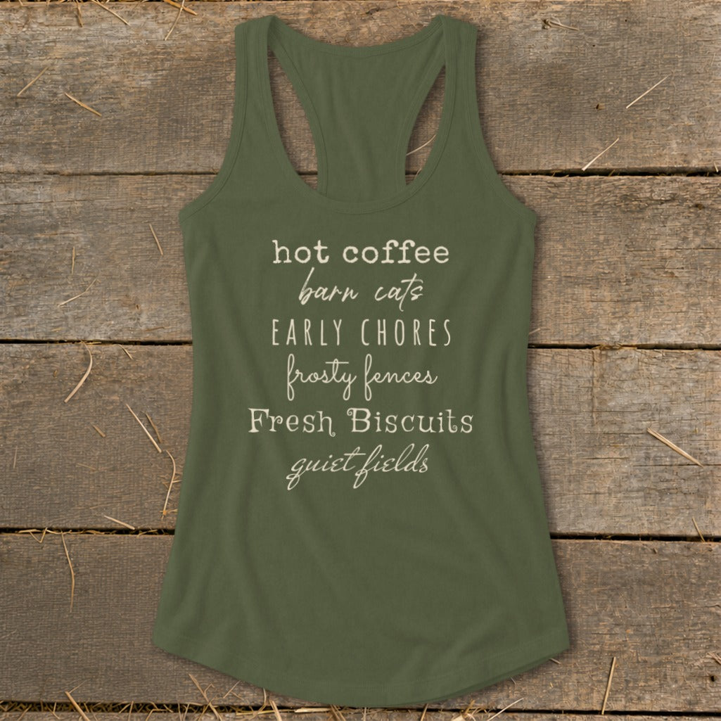 Olive green tank top with white text: hot coffee, barn cats, early chores, frosty fences, fresh biscuits, quiet fields.