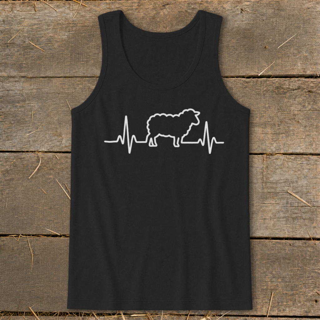 A black tank top featuring a white heartbeat line graphic with a sheep silhouette in the center, displayed on a rustic wooden background.