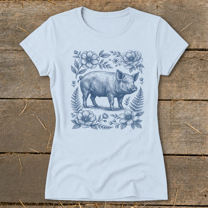 Light blue t-shirt with a detailed blue ink drawing of a pig surrounded by flowers.