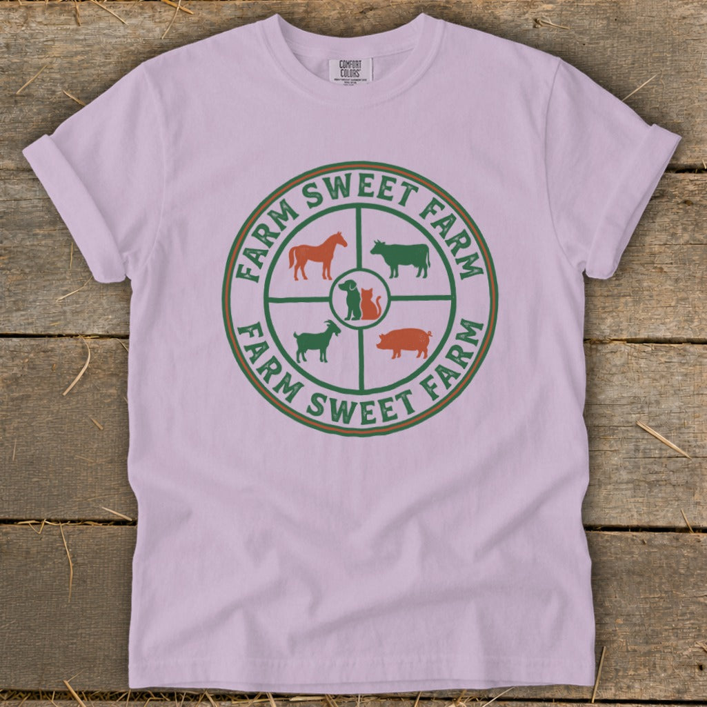 Farm Sweet Farm logo with farm animals on a light pink t-shirt.