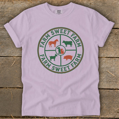 Farm Sweet Farm logo with farm animals on a light pink t-shirt.