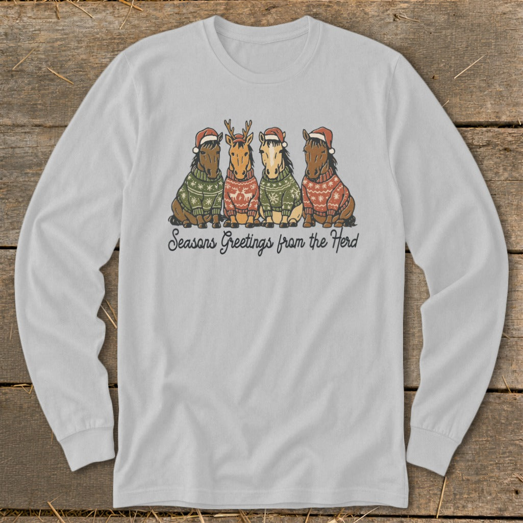 Four horses in Christmas sweaters and Santa hats with text "Seasons Greetings from the Herd".