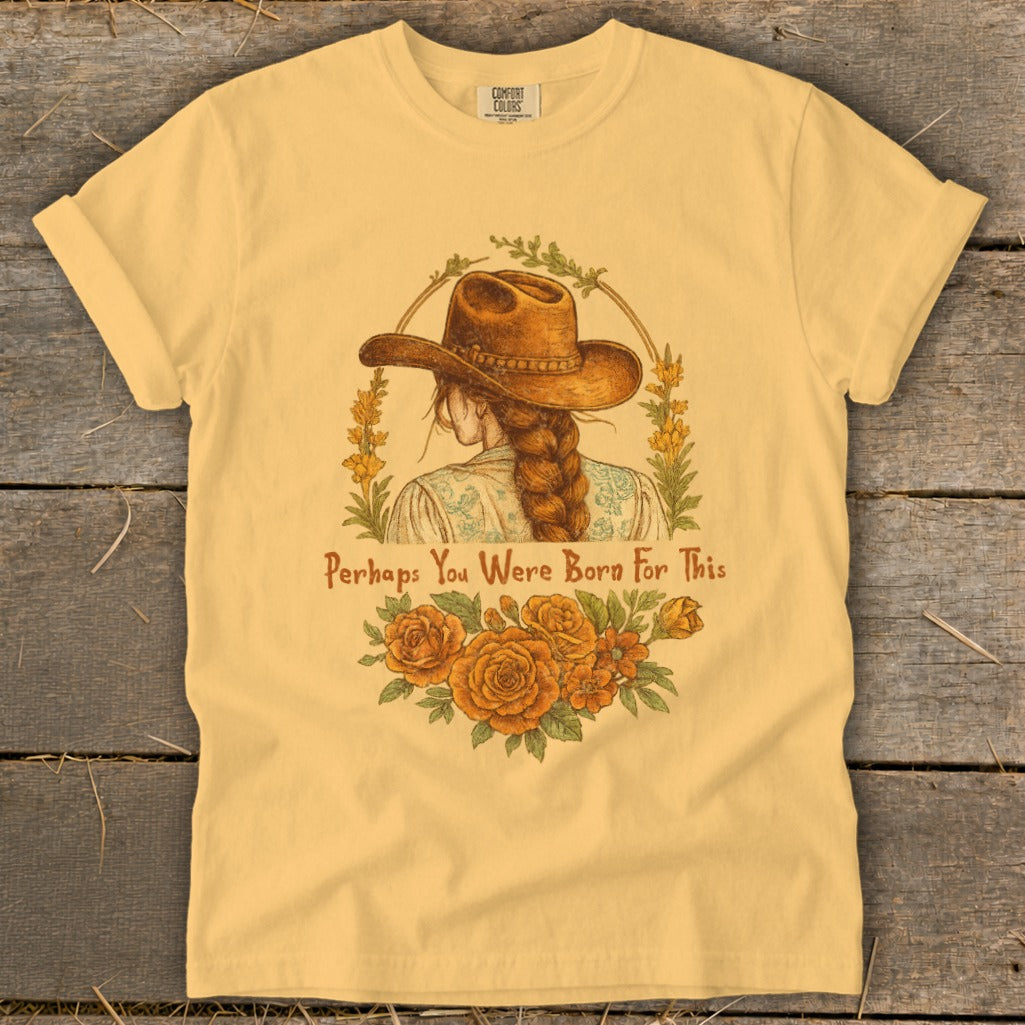 Yellow t-shirt with illustration of a woman in a cowboy hat and text "Perhaps You Were Born For This".