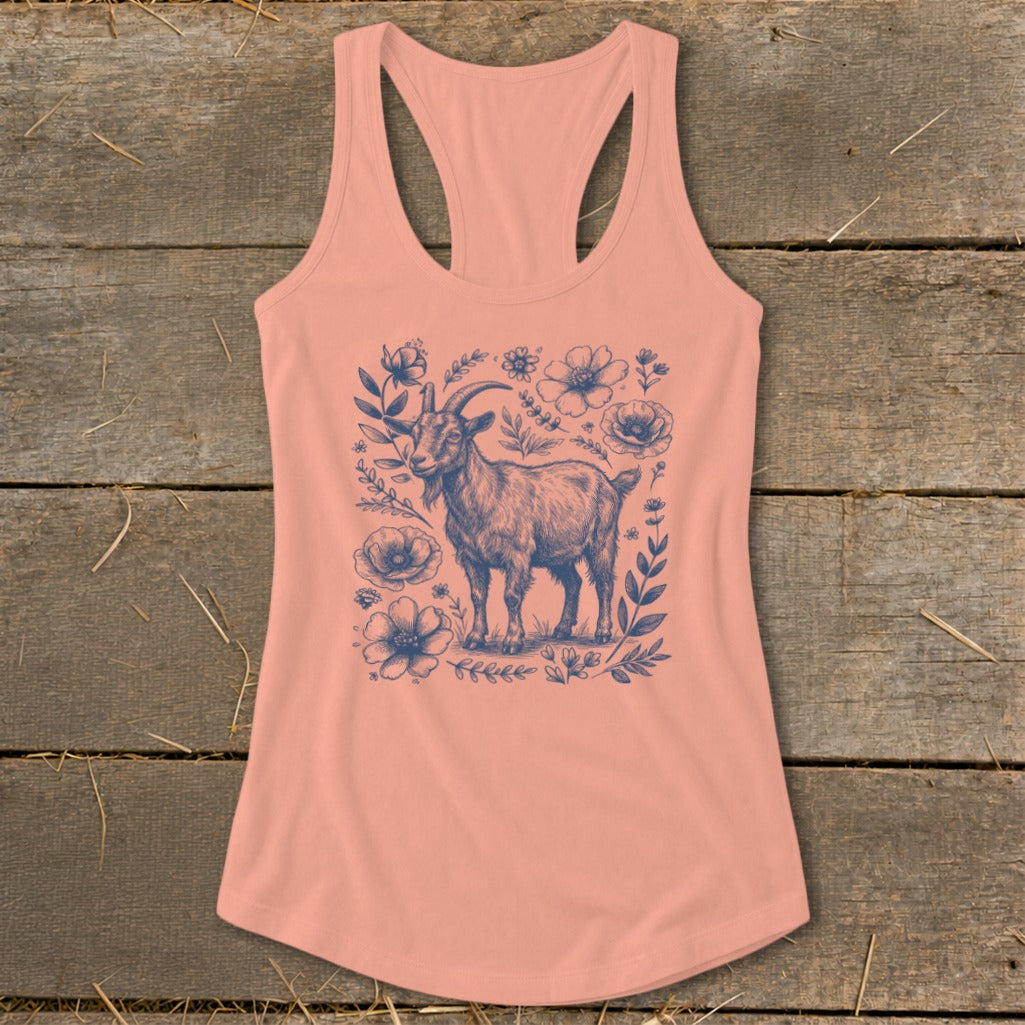 Peach tank top with a navy blue sketch of a goat surrounded by flowers and leaves.