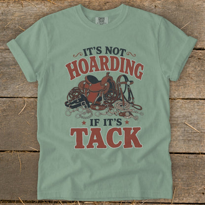 Light green t-shirt with "It's not hoarding if it's tack" and horse tack graphic.