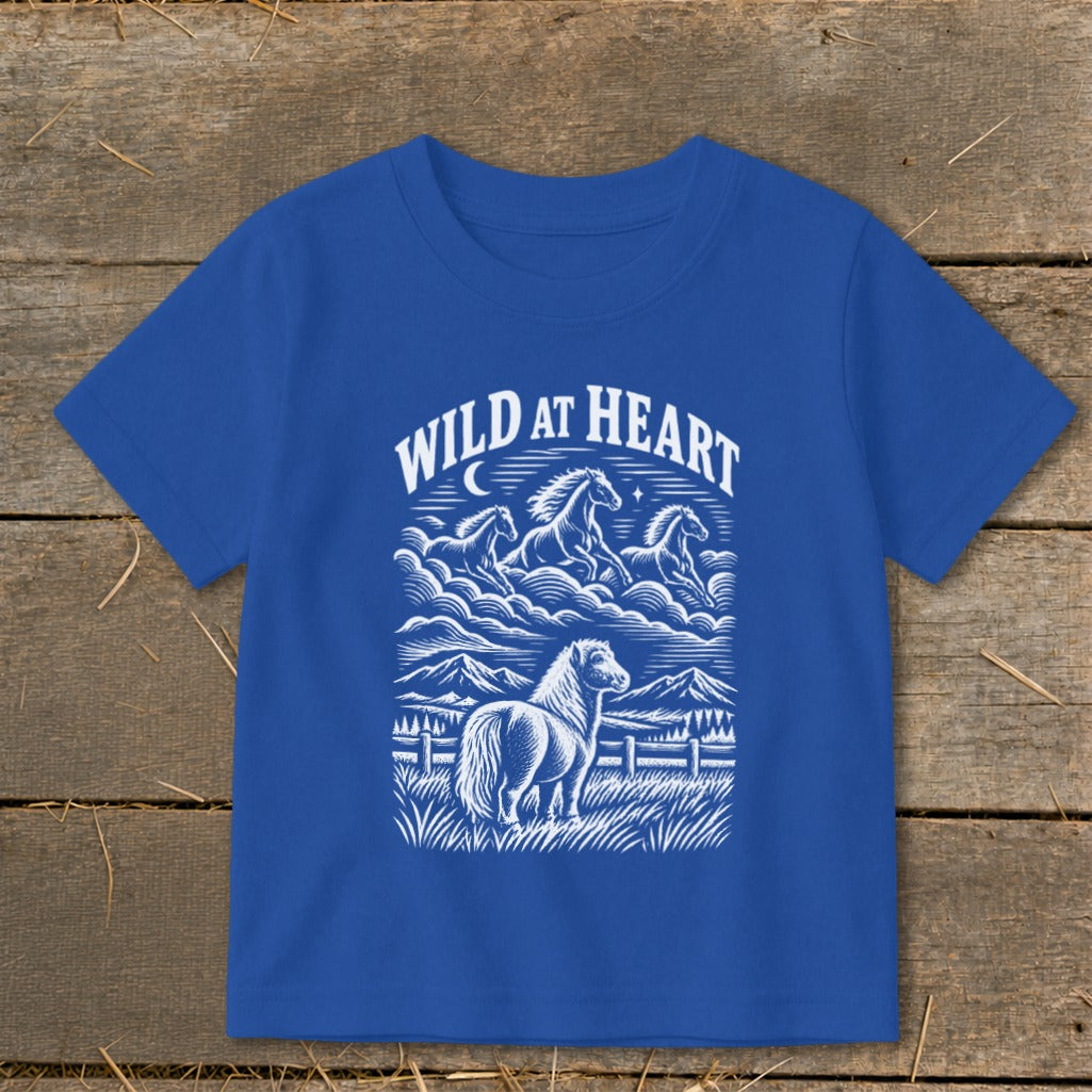 Blue t-shirt with "WILD AT HEART" text and horse graphic.