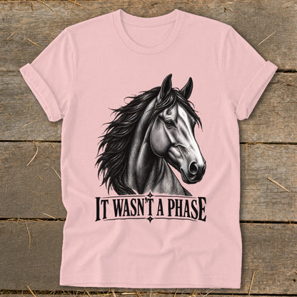 Pink t-shirt with horse graphic and text "IT WASN'T A PHASE".