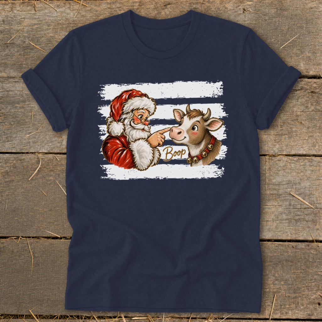 Santa booping a cow with the word "Boop" on a navy blue t-shirt.