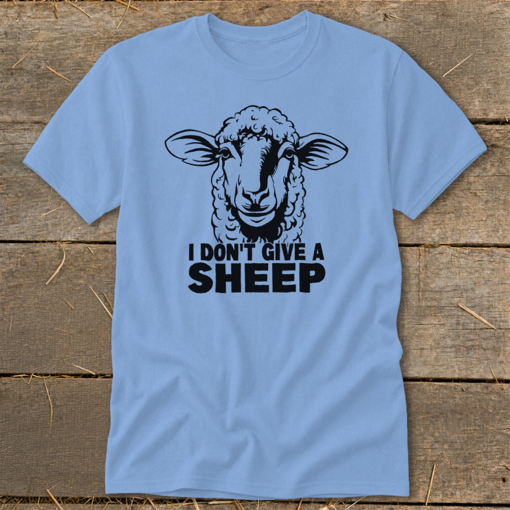 Light blue t-shirt with a black graphic of a sheep and text that reads "I DON'T GIVE A SHEEP".