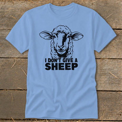 Light blue t-shirt with a black graphic of a sheep and text that reads "I DON'T GIVE A SHEEP".