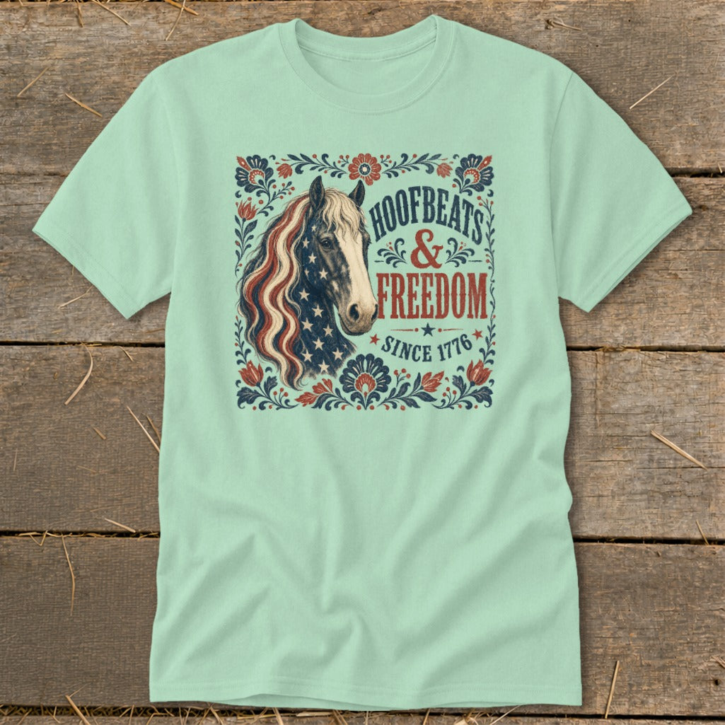 Mint t-shirt with patriotic horse graphic and text "Hoofbeats & Freedom Since 1776".