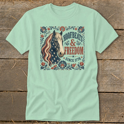 Mint t-shirt with patriotic horse graphic and text "Hoofbeats & Freedom Since 1776".