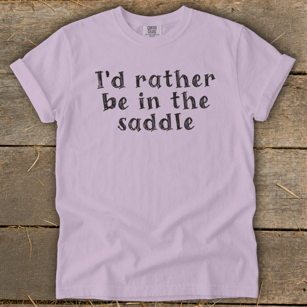Lavender t-shirt with black text: "I'd rather be in the saddle".