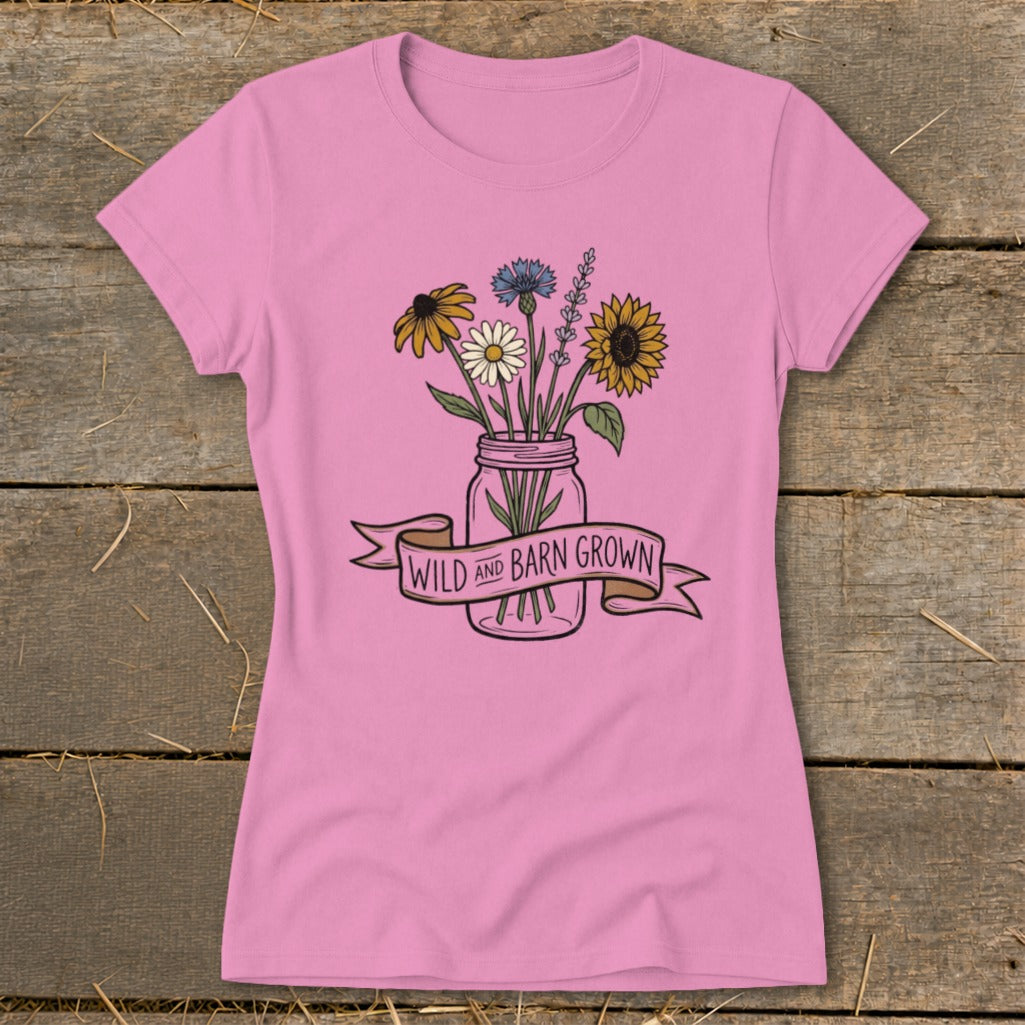 Pink t-shirt with a mason jar of wildflowers and "Wild and Barn Grown" banner.