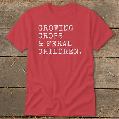 Red t-shirt with white text "GROWING CROPS & FERAL CHILDREN."