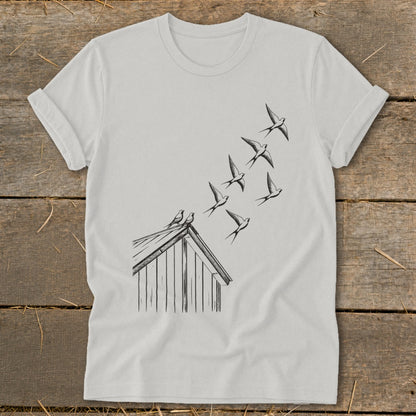 Light gray t-shirt featuring a black line drawing of swallows flying up from a cabin roof.
