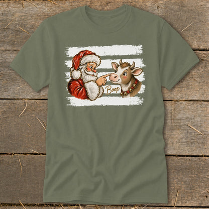 Santa booping a cow's nose with the word "Boop" in cursive text.