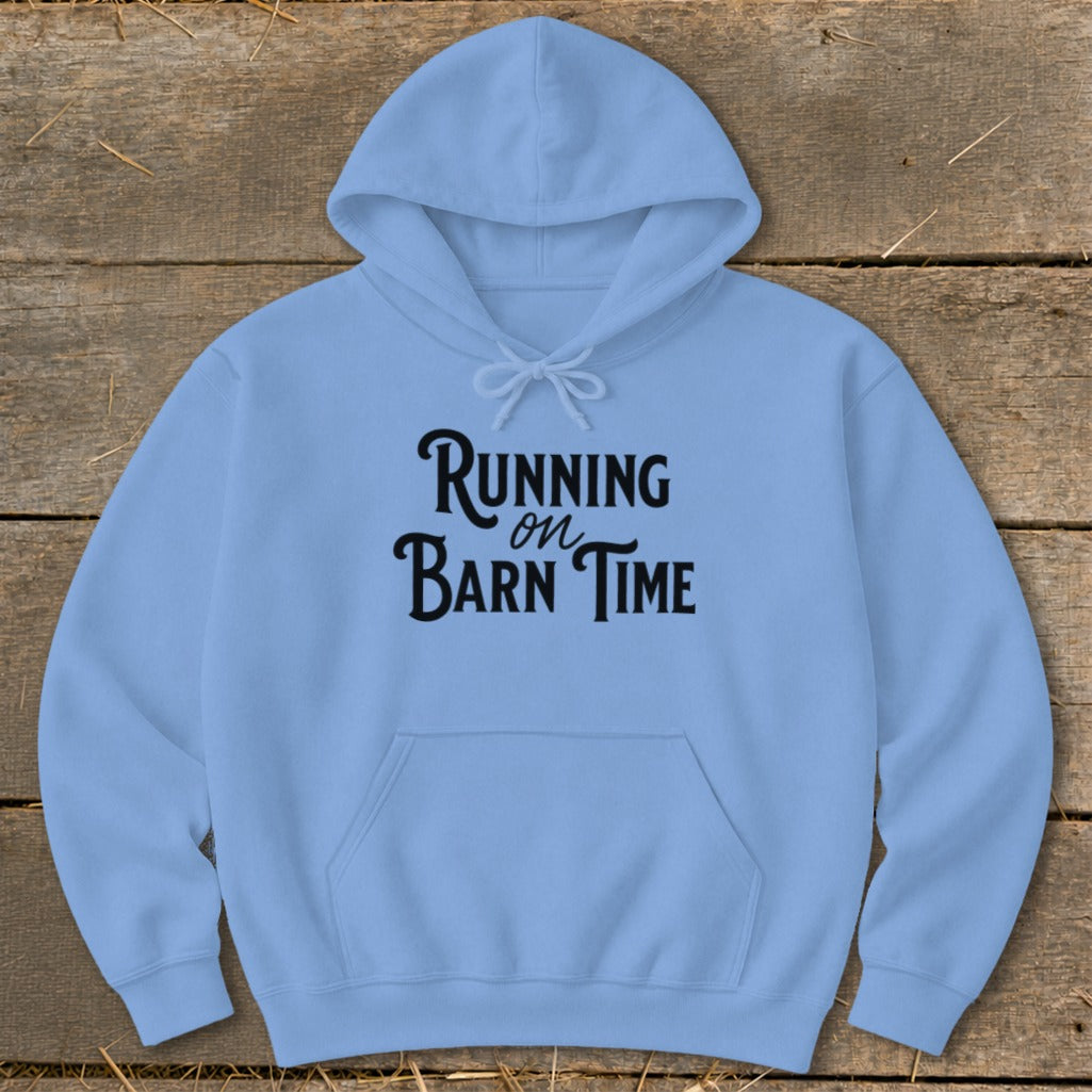 Light blue hoodie with "Running on Barn Time" text on the front.