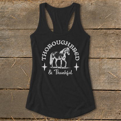 Black racerback tank top with white "Thoroughbred & Thankful" text and horse graphic.