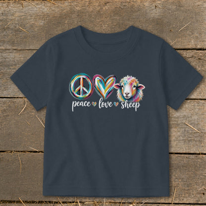 Dark t-shirt with peace, heart, and sheep graphics with text "peace love sheep".