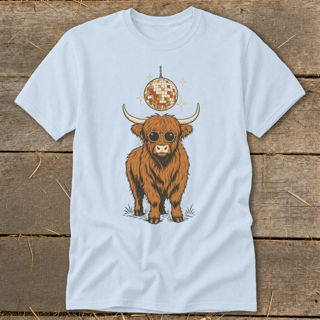 Fluffy brown Highland cow with sunglasses and disco ball hangs above.