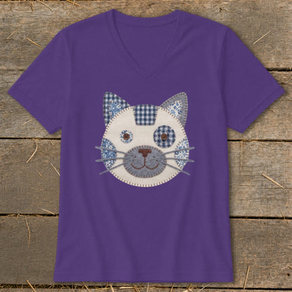 Purple v-neck t-shirt with a whimsical fabric cat face applique.