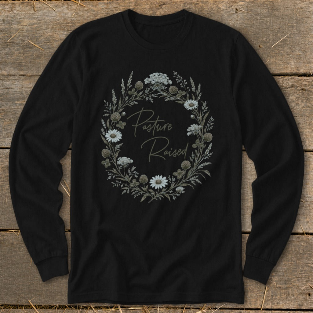 Black long-sleeve shirt with "Pasture Raised" inside a floral wreath graphic.