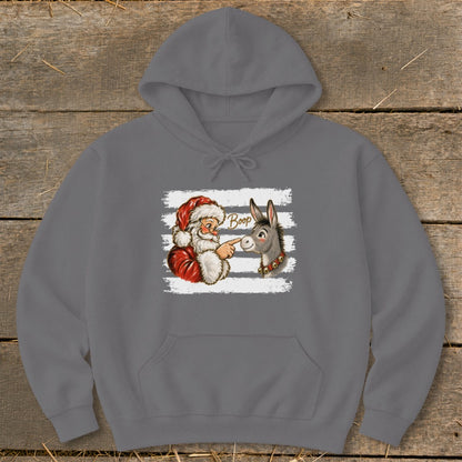 Santa "booping" a donkey with the word "Boop" above it.