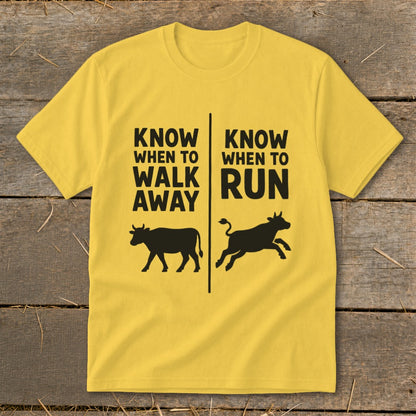 Yellow t-shirt with black text and cow silhouettes: "Know When to Walk Away" and "Know When to Run".
