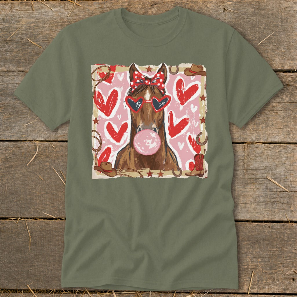 Horse wearing heart sunglasses and bow, blowing bubblegum, with hearts and western accents.