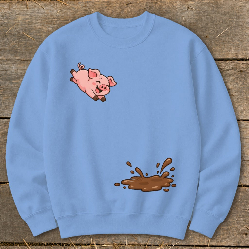 Light blue sweatshirt with a cartoon pig jumping over a mud splash graphic.