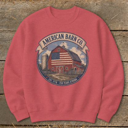 American Barn Co. graphic on a coral sweatshirt featuring a barn with American flag, silo, and text.