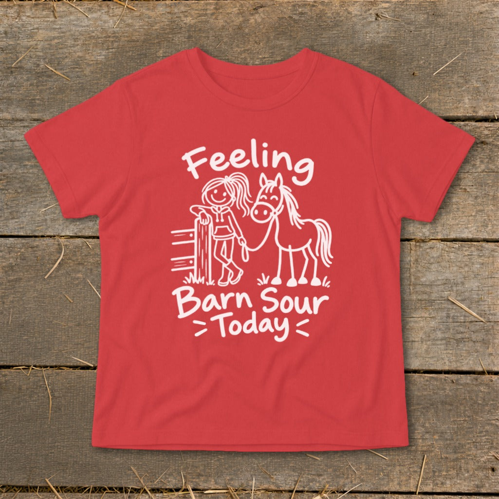 Red t-shirt with white text and cartoon of girl holding horse, reading "Feeling Barn Sour Today".