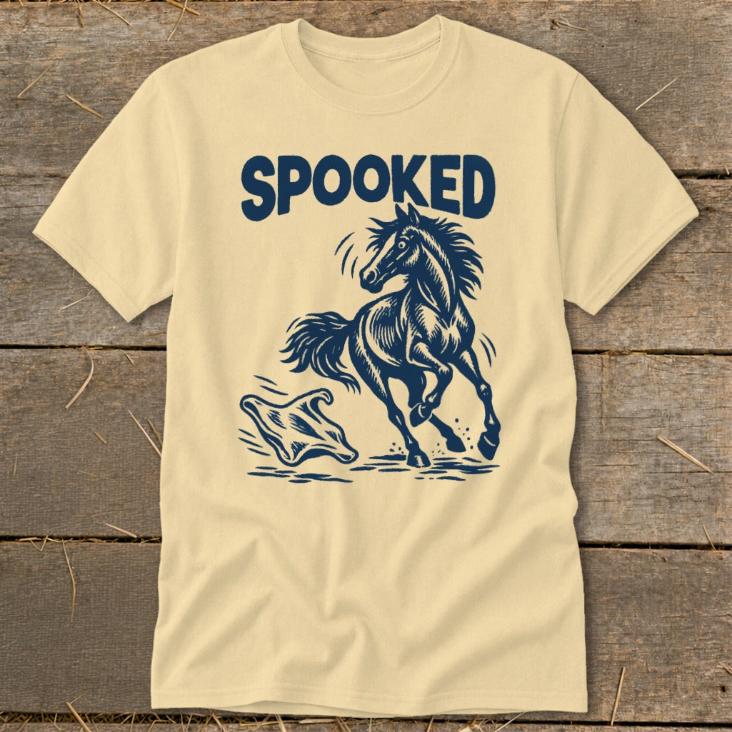 Light yellow t-shirt with navy graphic of a startled horse running from a ghost.