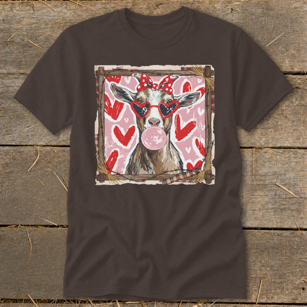 Goat wearing heart sunglasses and a bow blows bubblegum, surrounded by pink and red hearts.