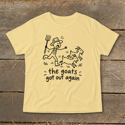 Yellow t-shirt with a cartoon of a farmer chasing three goats, text "the goats got out again".