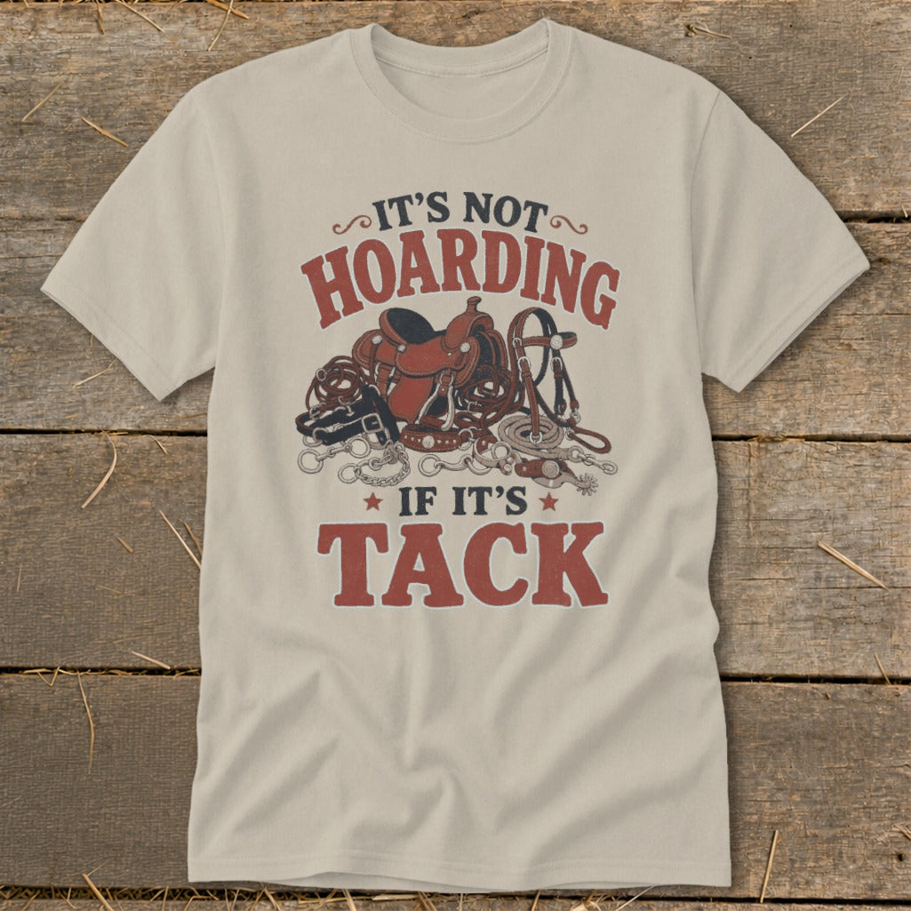 T-shirt with "It's not hoarding if it's tack" text and horse tack illustration.