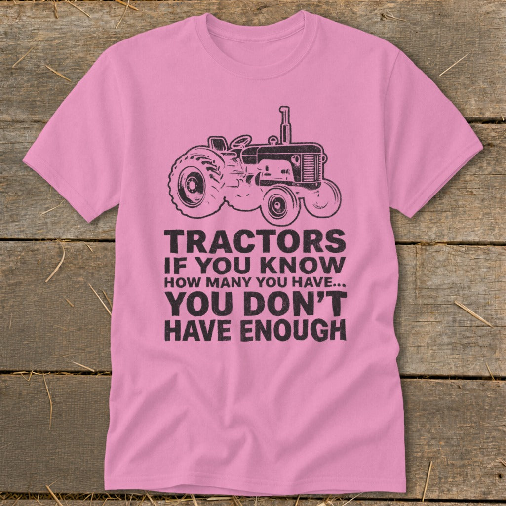 Pink t-shirt with vintage tractor graphic and text: "Tractors If You Know How Many You Have... You Don't Have Enough".